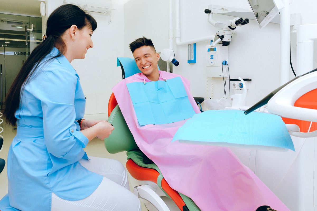 Patient smiling in the dental chair during a consultation