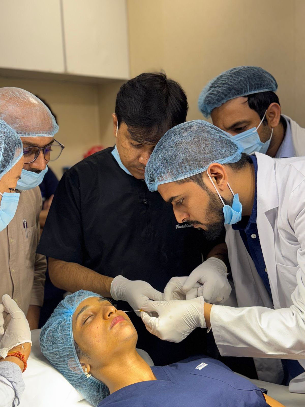 Dermatologist examining a patient’s skin