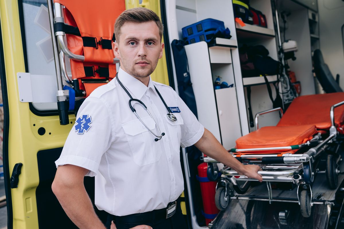 Paramedic holding a stretcher, ready for an emergency call