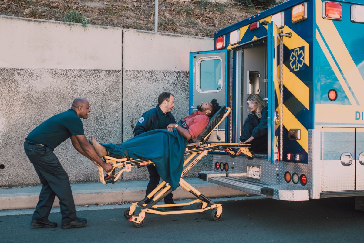 Emergency team moving a patient on a stretcher
