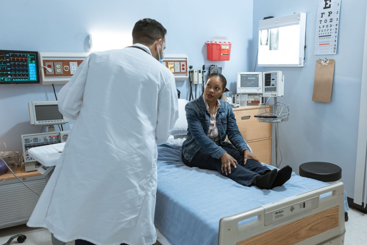 Physician consulting with a patient in an exam room