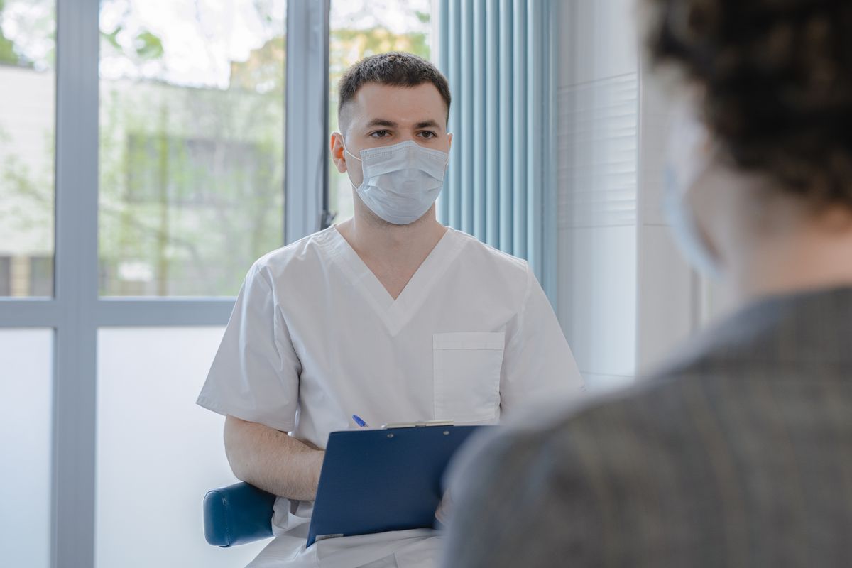 Physician consulting with a patient