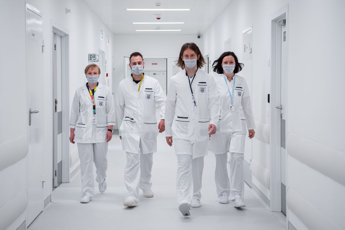 Team of doctors and nurses in a hospital corridor